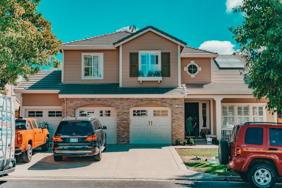 Family standing outside their home with newly installed residential solar panels